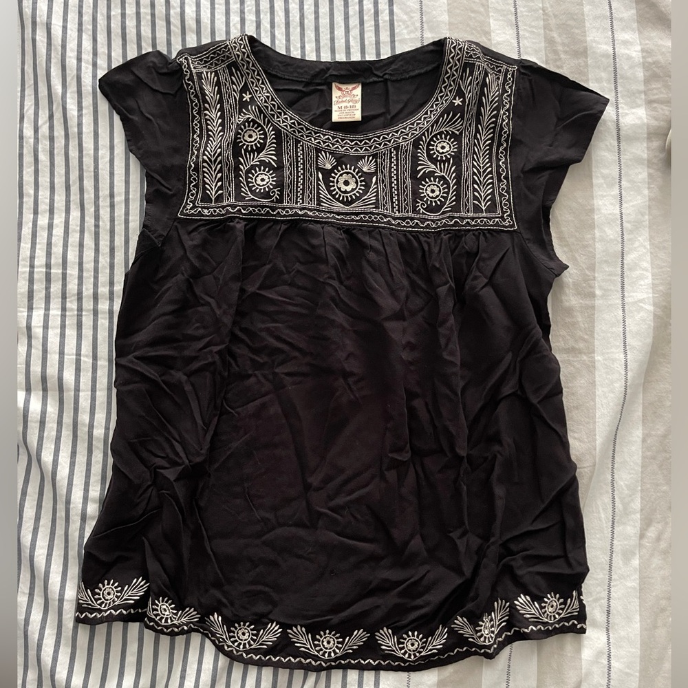 Faded Glory short sleeve blouse with embroidery around top and hem, size M.